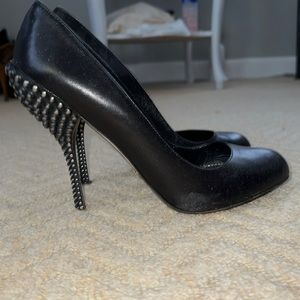 Sergio Rossi black leather pump with a metal heel detail